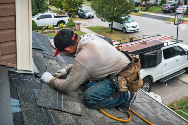 Professional Roof Repair technician working in Winburne, PA